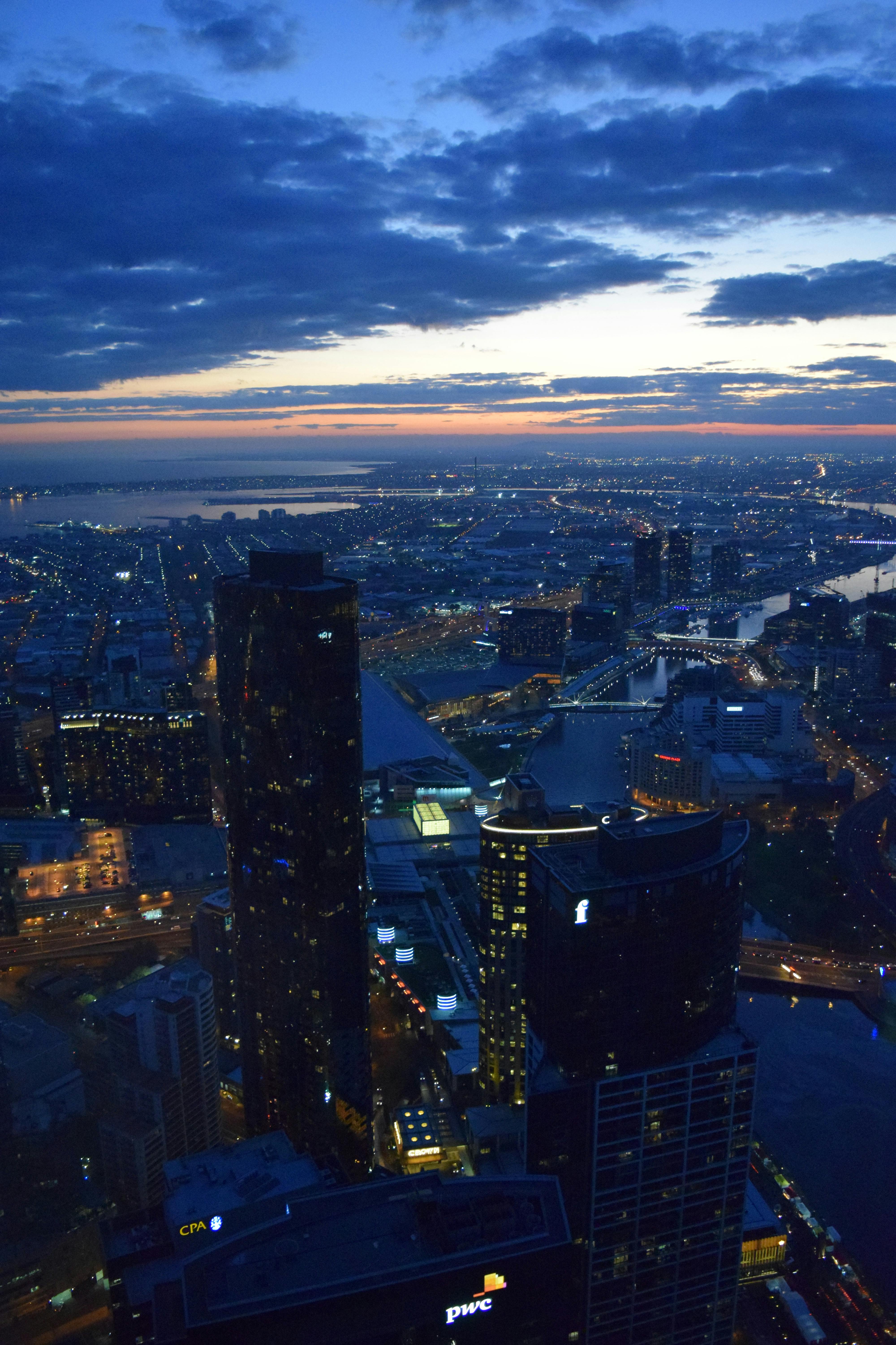 Night city skyline with blue sky